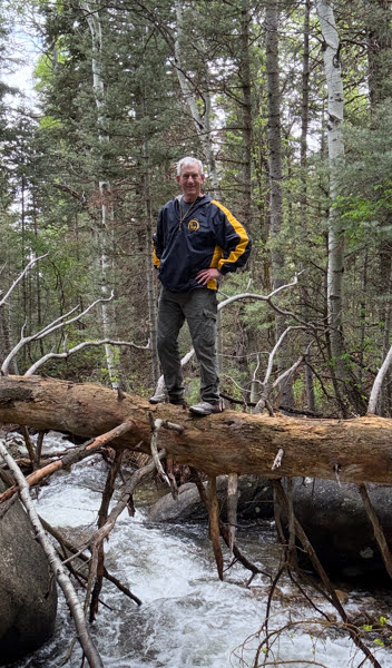 Old Hiking Dude on a log