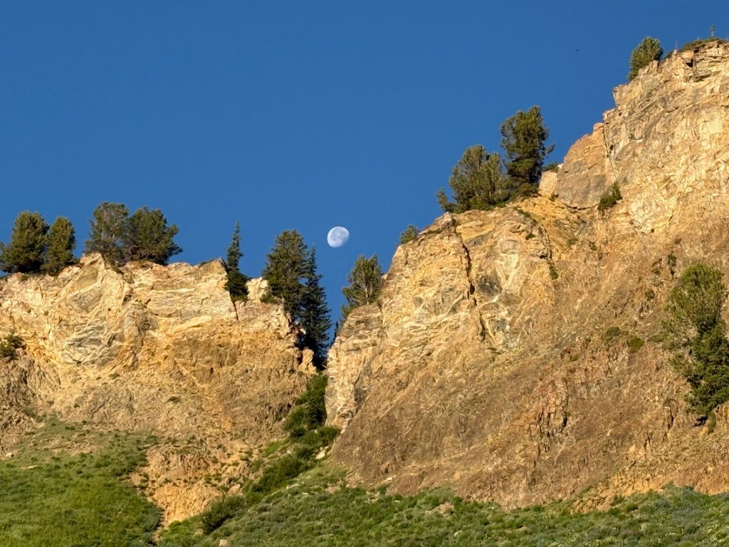 Moon over a mountain ridge at Alta