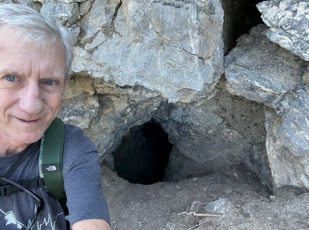 Old Hiking Dude outside the opening of an old mine on Kessler Peak