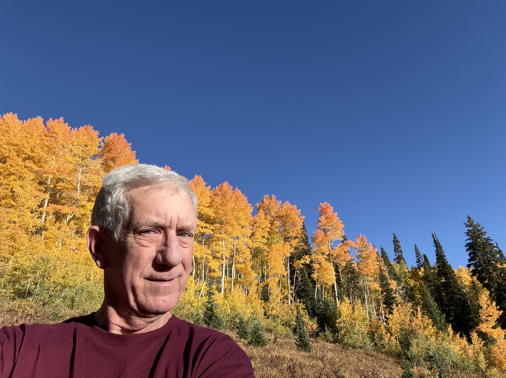 Old Hiking Dude and aspens in the fall
