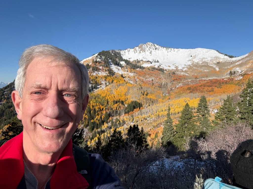 Old Hiking Dude with Mt Raymond in background