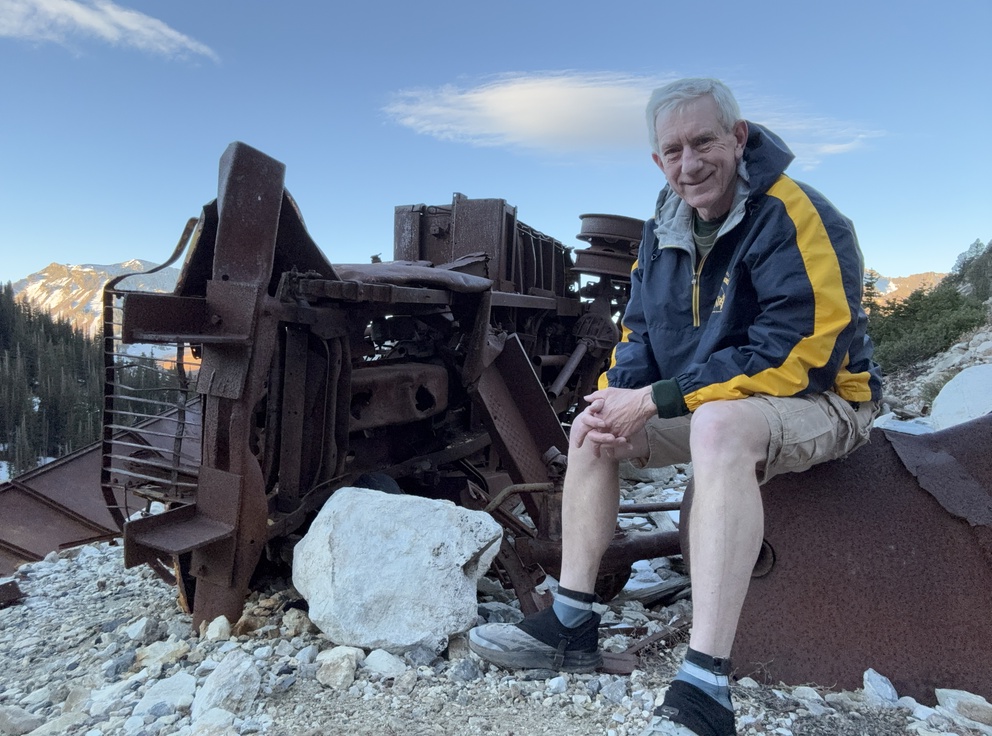 Old Hiking Dude with mining equipment