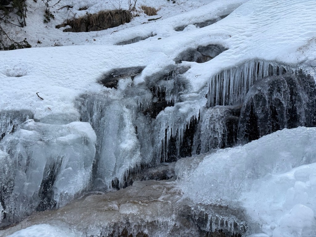 Flowing water and ice at Gloria Falls, Utah