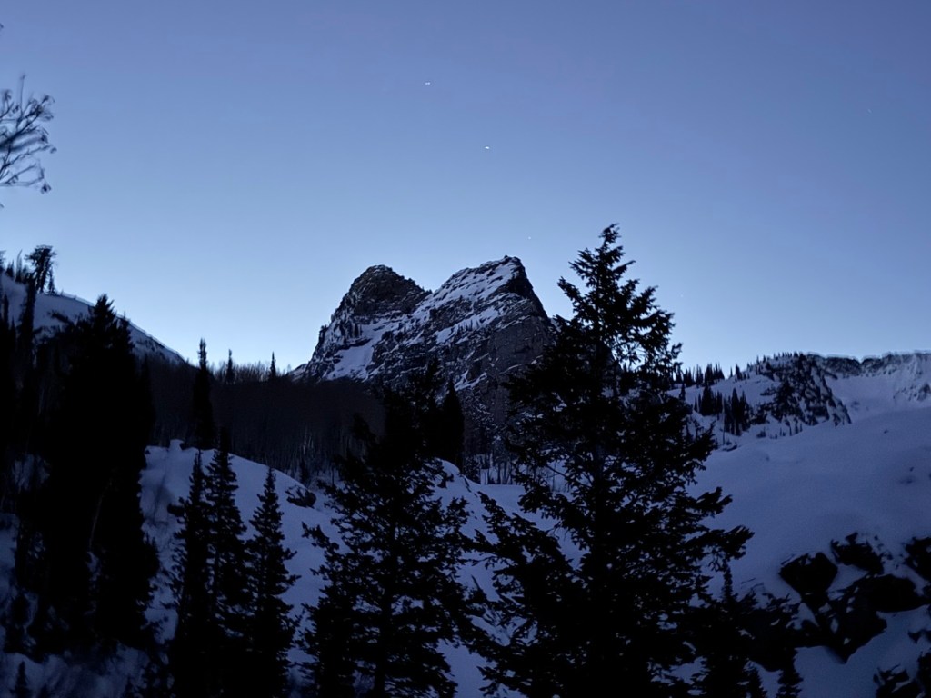 Sundial Peak with stars above on an early winter morning