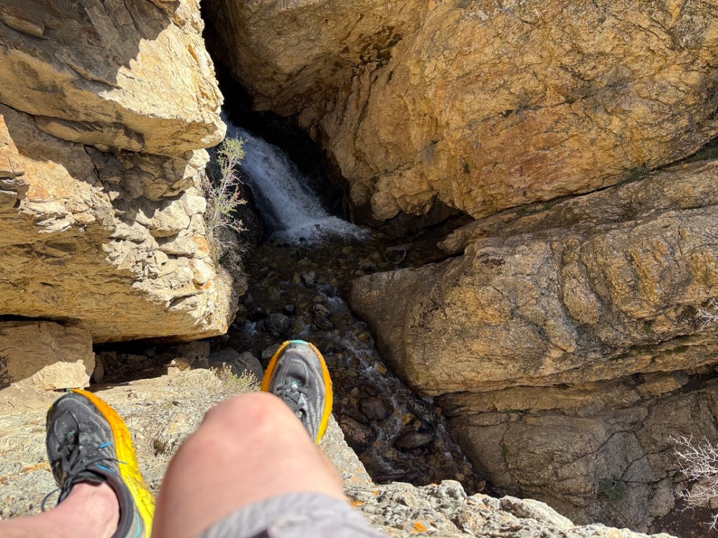 Old Hiking Dude feet across from and above Hidden Falls