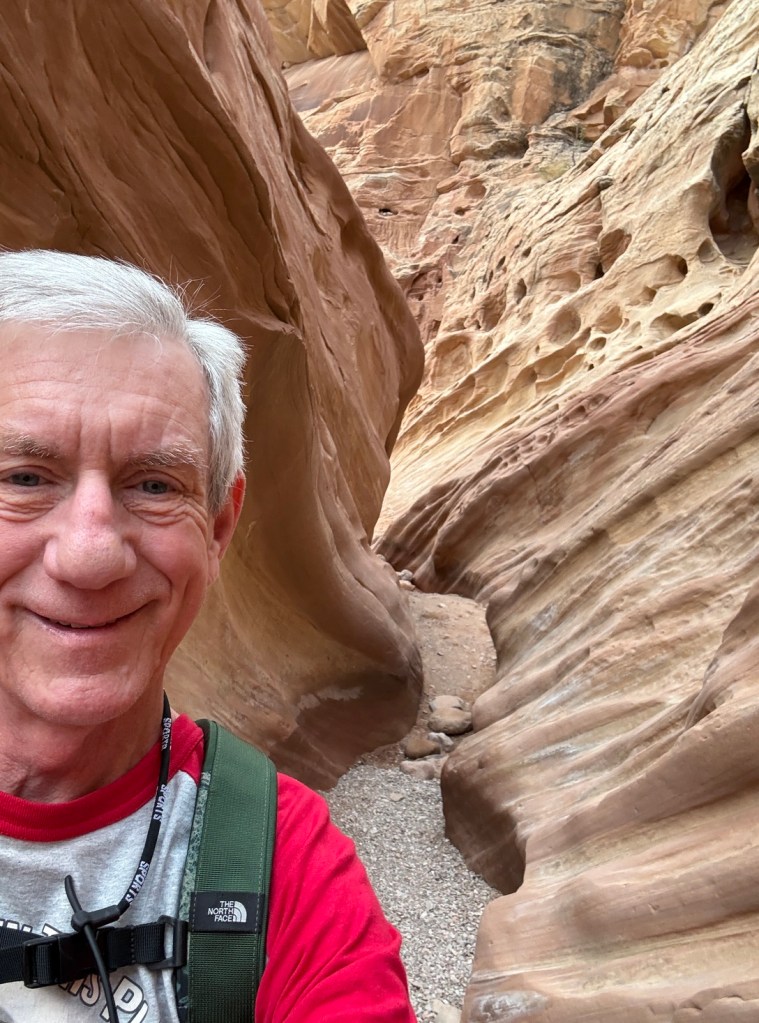 Old Hiking Dude hiking in Little Wild Horse Canyon